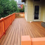Composite deck with wood railing